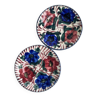 Pair of decorative ceramic plates with floral motifs.