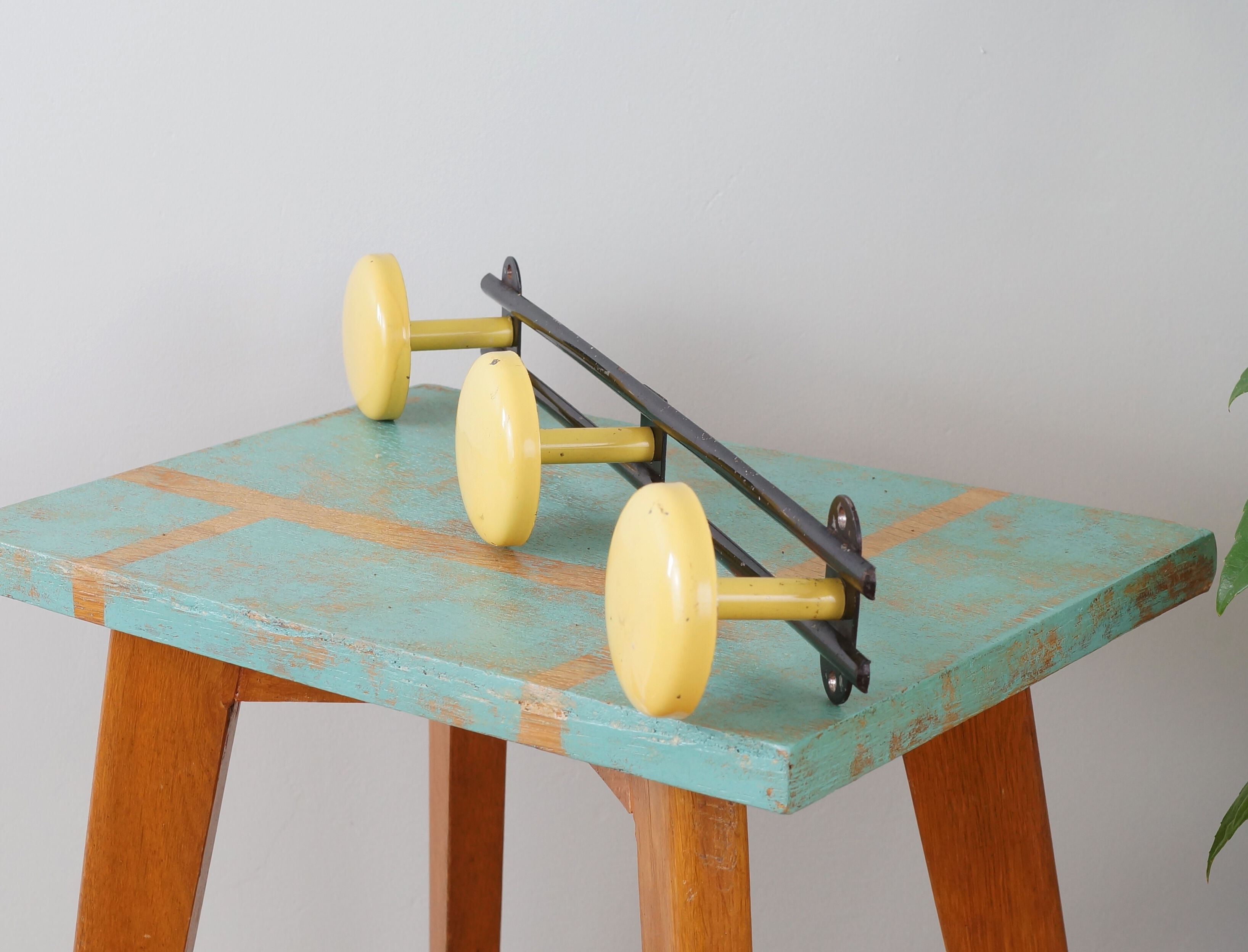 Yellow and black enamelled metal hook, 60s
