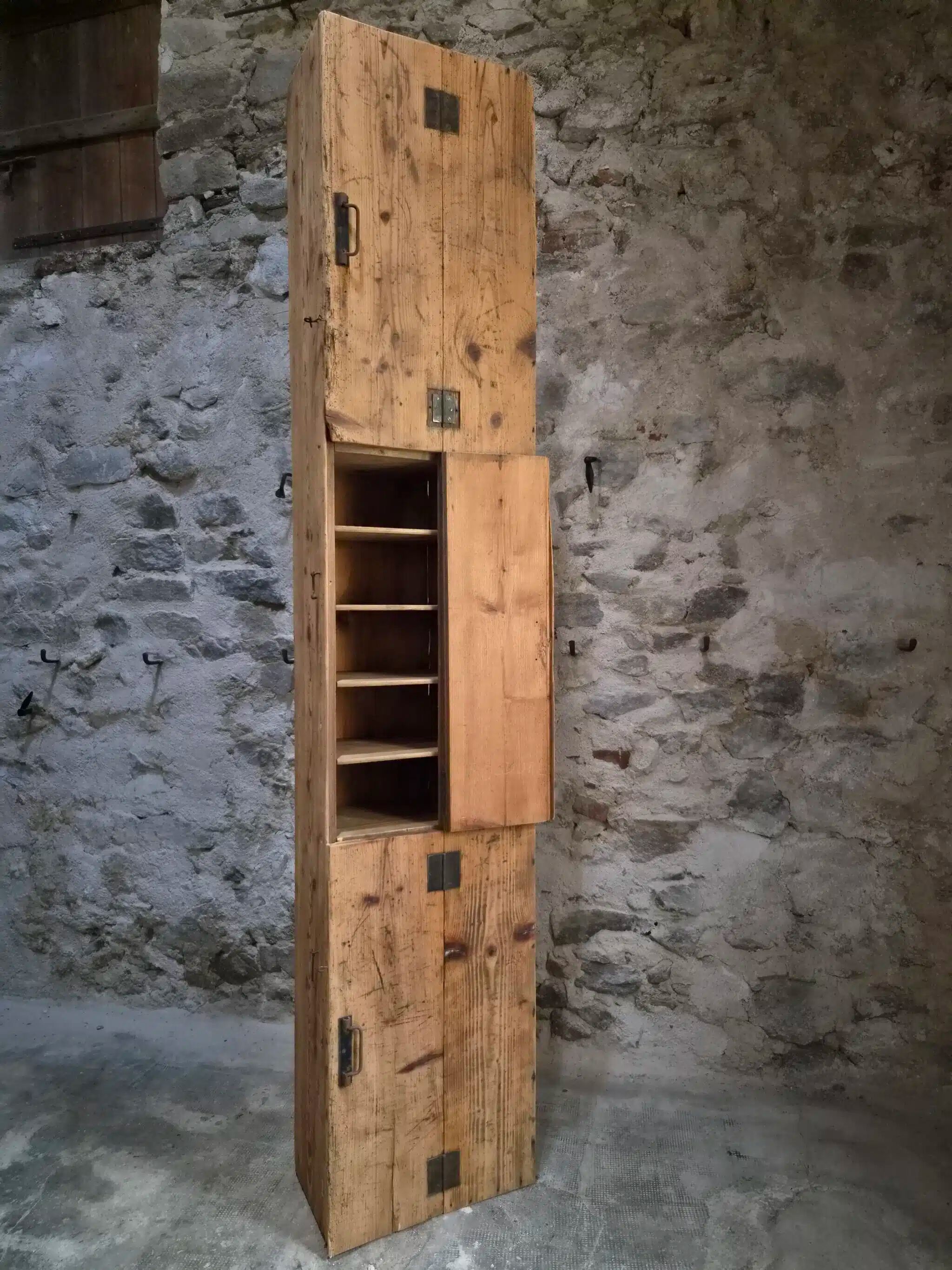 Antique French workshop cabinet in pine with compartments.