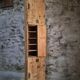 Antique French workshop cabinet in pine with compartments.