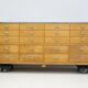 Shop counter made of birch and oak with twenty drawers, 1940s.