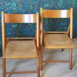 2 folding chairs in cannage
