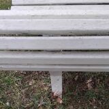 Old garden bench with metal legs and wooden slats