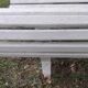 Old garden bench with metal legs and wooden slats