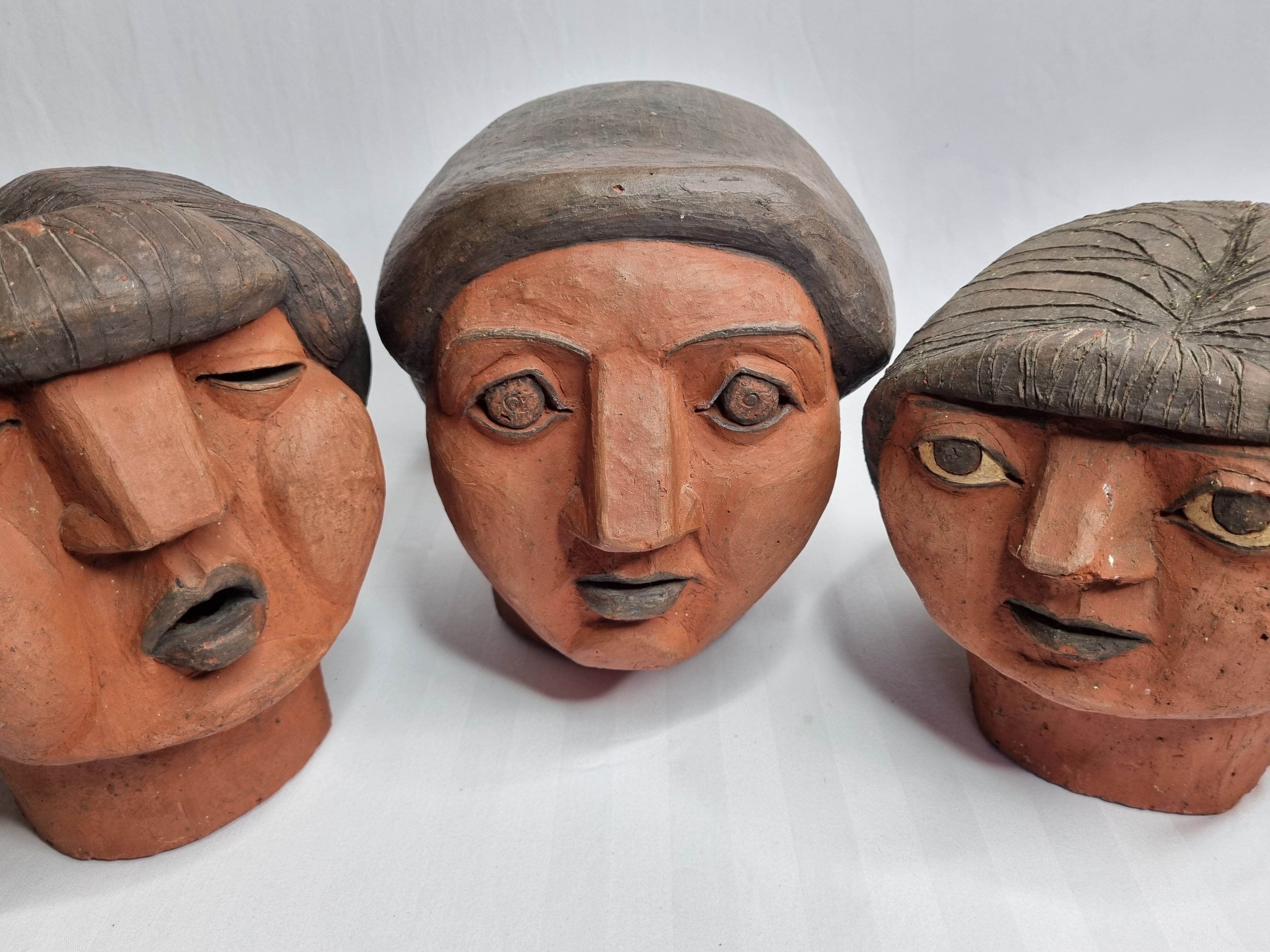 Set of 3 decorative women's heads in red terracotta