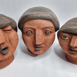 Set of 3 decorative women's heads in red terracotta