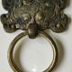 Ancient door knocker, taotié mask, shang dynasty. in bronze golden patina