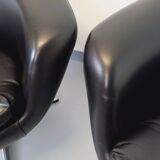 Pair of vintage Scandinavian swivel armchairs in faux leather and chrome.