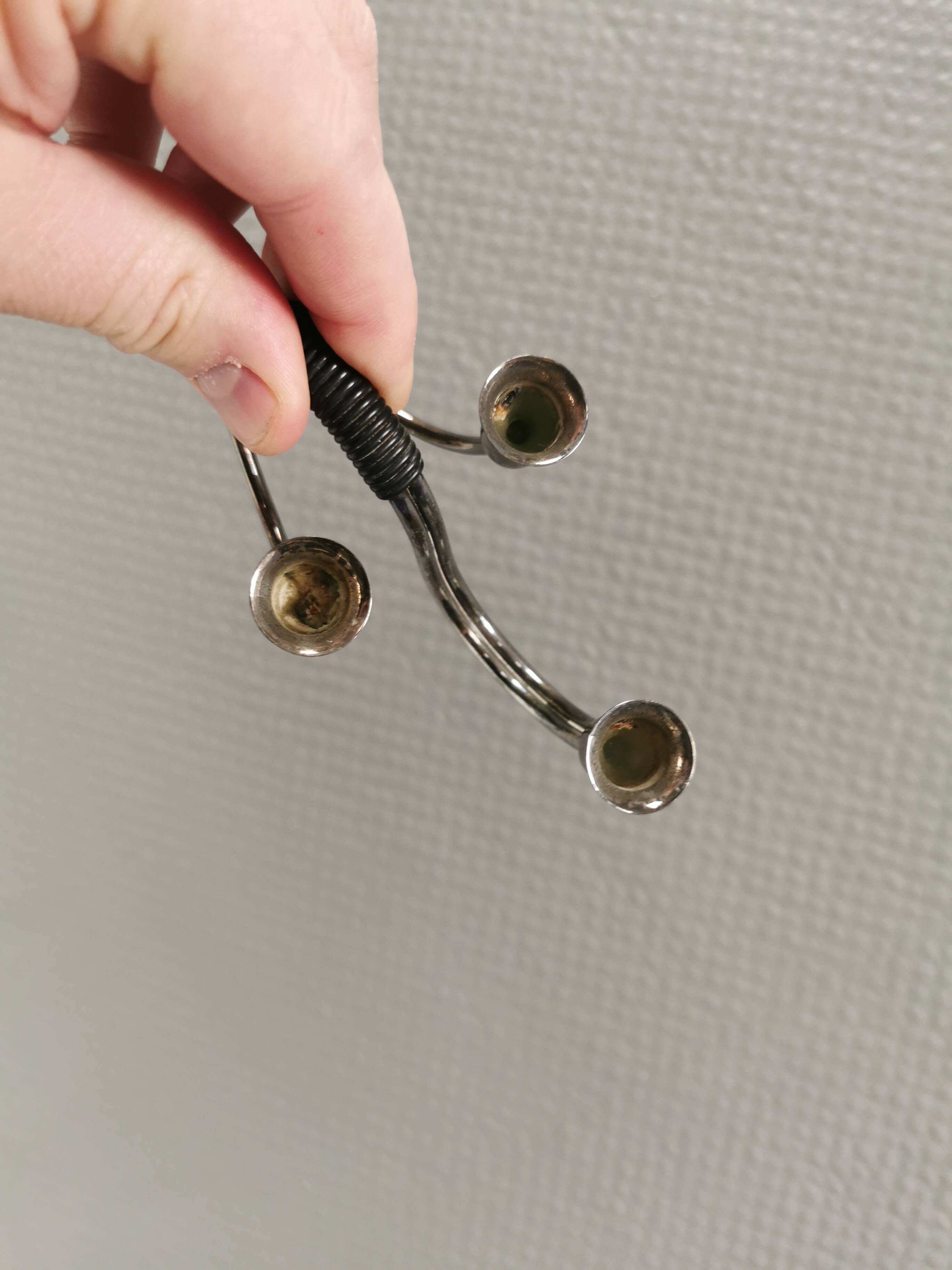 Small candle holder in tarnished silver, with place for three small candles