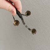 Small candle holder in tarnished silver, with place for three small candles
