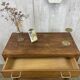 Commode aux pieds compas