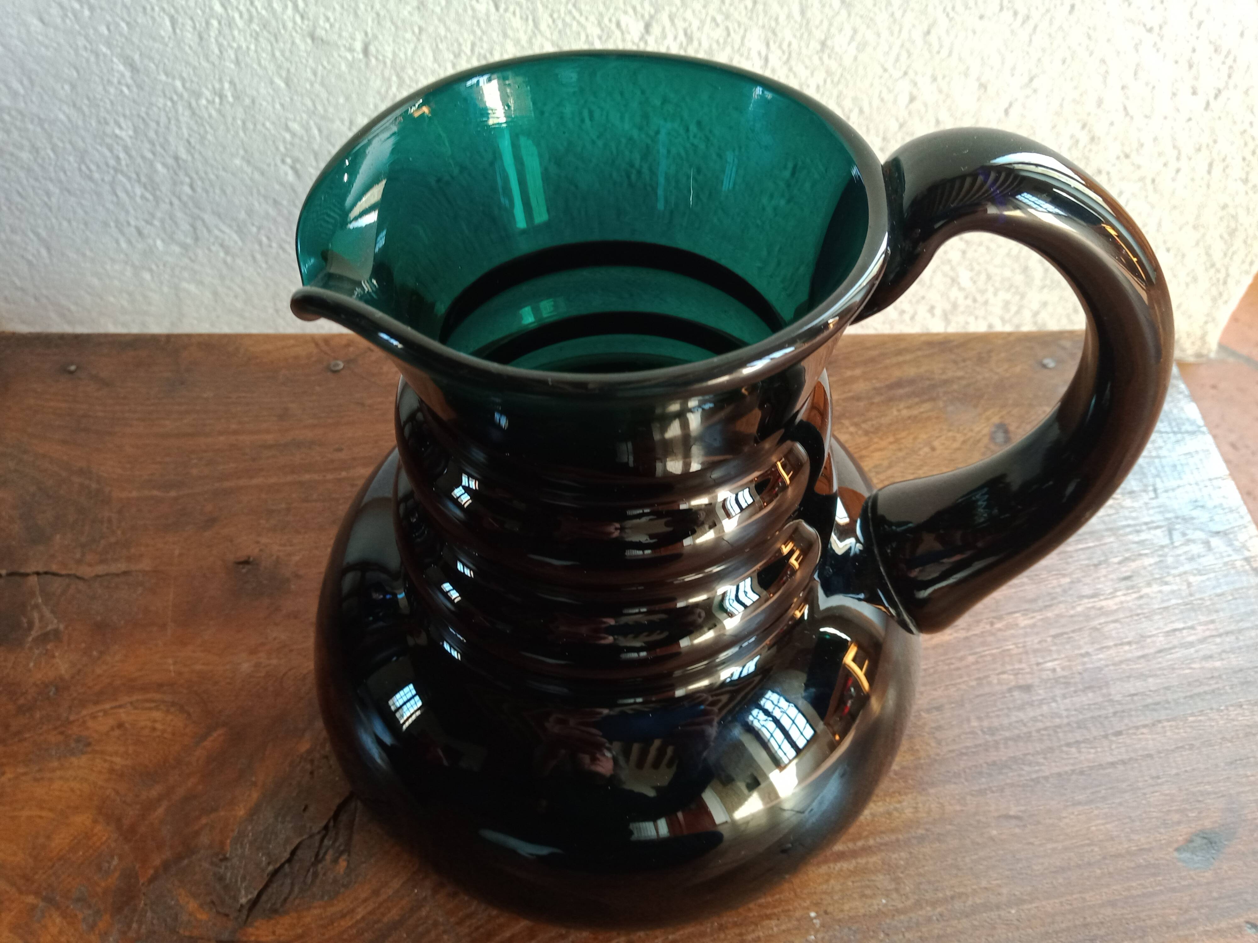 Deep green jug or pitcher with modern design - thick glass