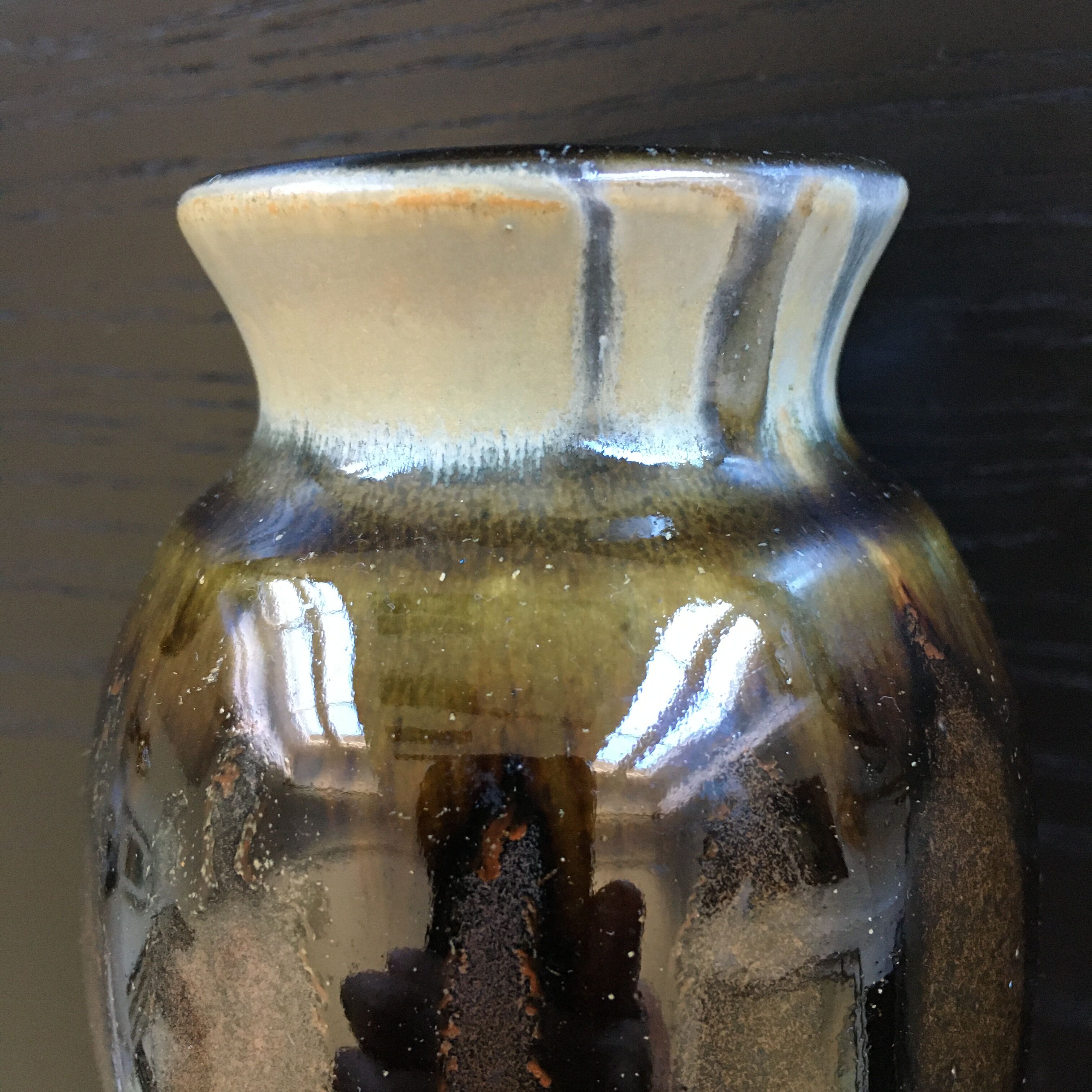 Brown and black flame-colored vase