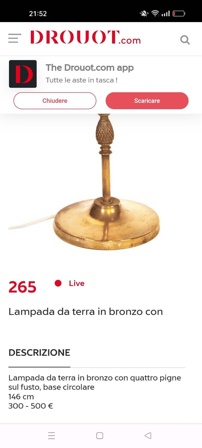 Bronze floor lamp with pine cone decoration.