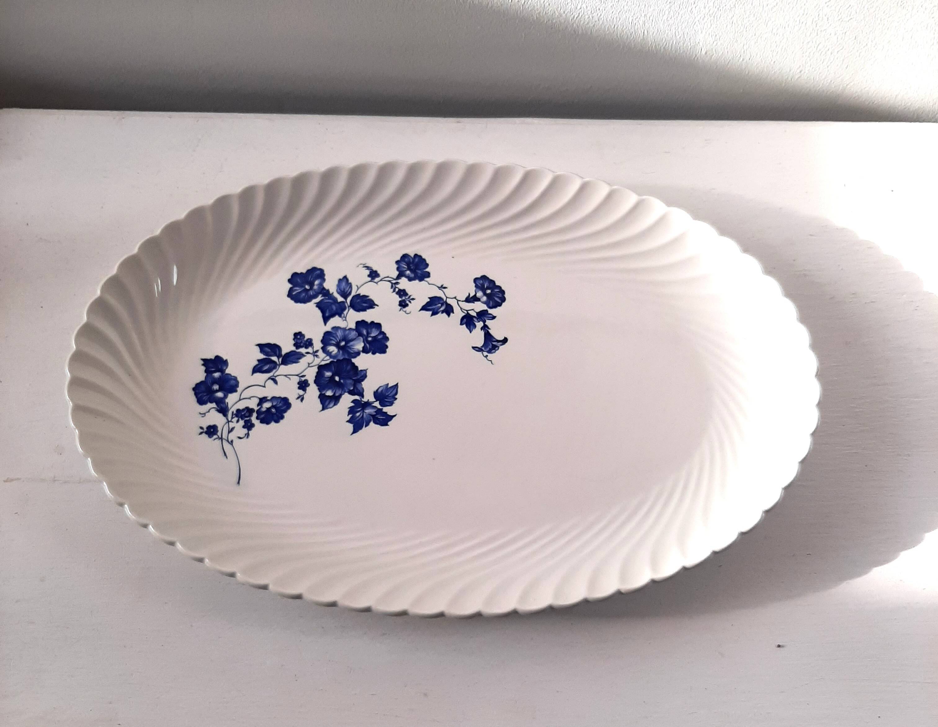 Keller and Guérin Lunéville serving dish with blue flowers on a white background.