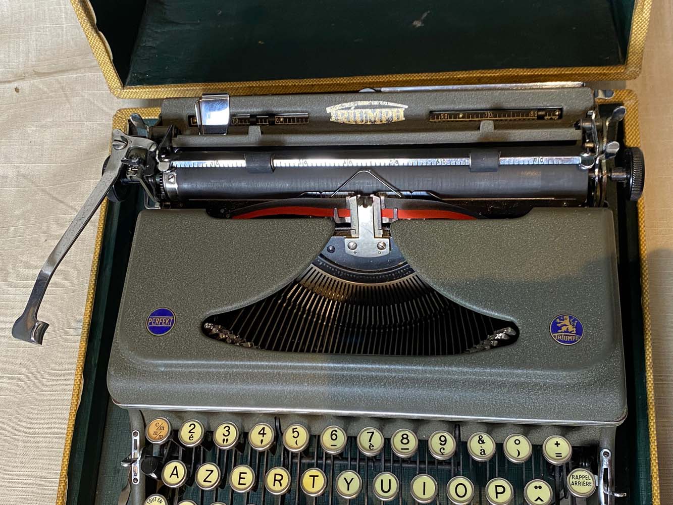 Triumph perfekt typewriter with its transport box.