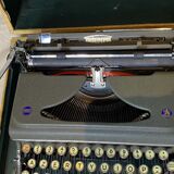 Triumph perfekt typewriter with its transport box.