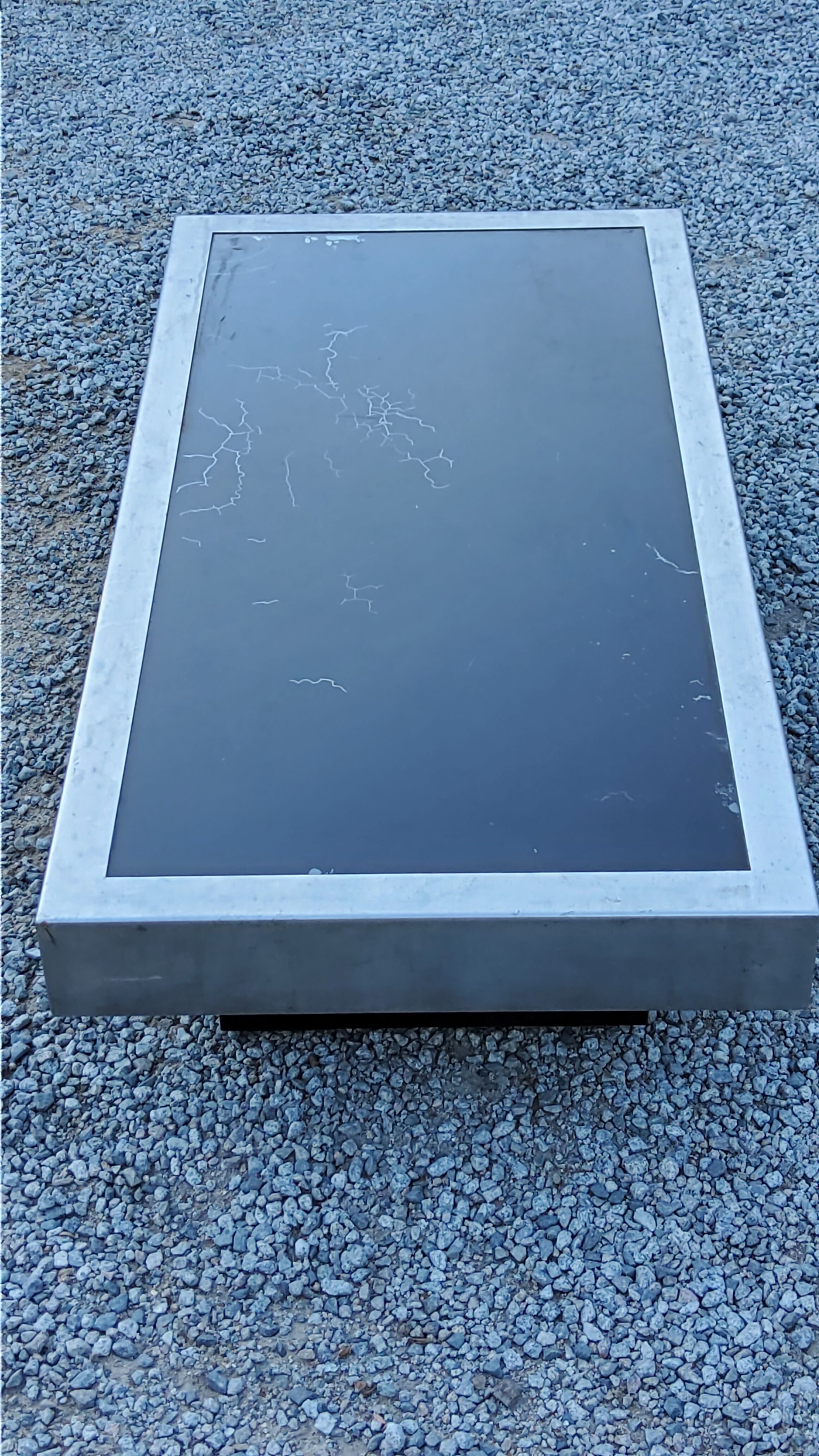 Coffee table in brushed steel and black tinted glass from the 70s