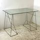 Minimalist glass and metal desk from the 1970s