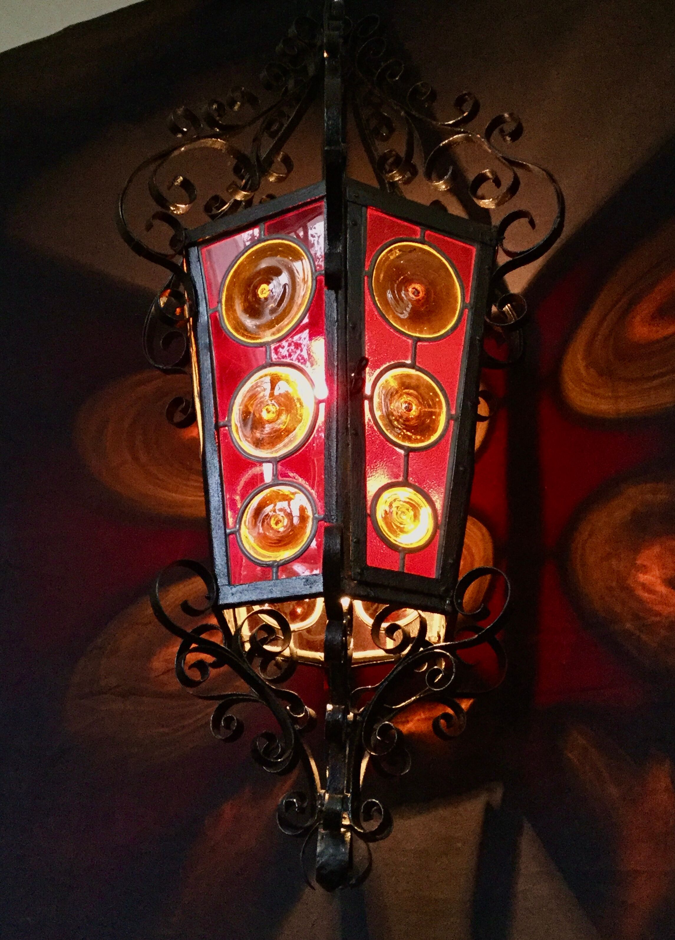 Wrought iron lantern and stained glass windows