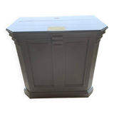 White counter with brass coin mechanism