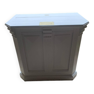 White counter with brass coin mechanism