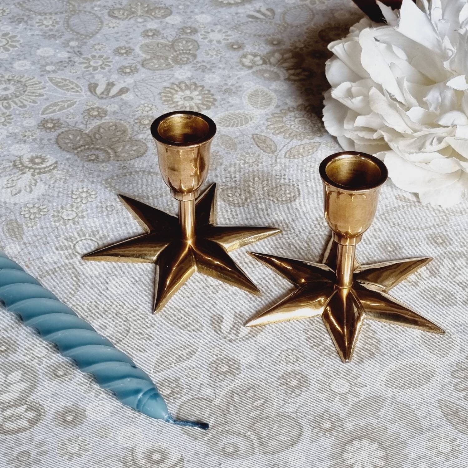 Duo of brass star candlesticks