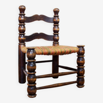 Chair in wood and colored straw attributed to Charles Dudouyt