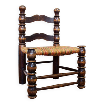 Chair in wood and colored straw attributed to Charles Dudouyt