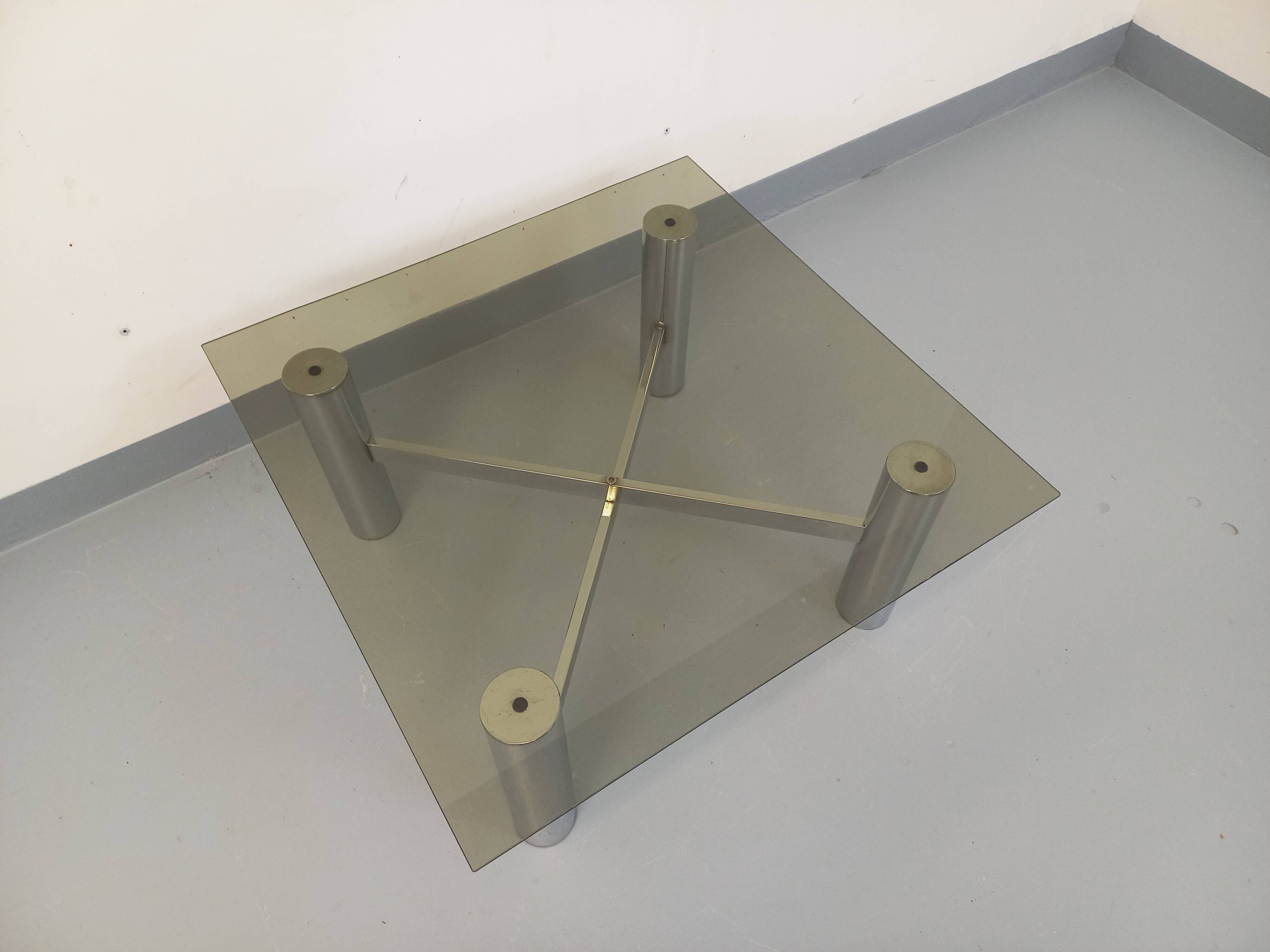Square Italian vintage Space Age coffee table in smoked glass and metal.