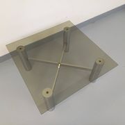 Square Italian vintage Space Age coffee table in smoked glass and metal.