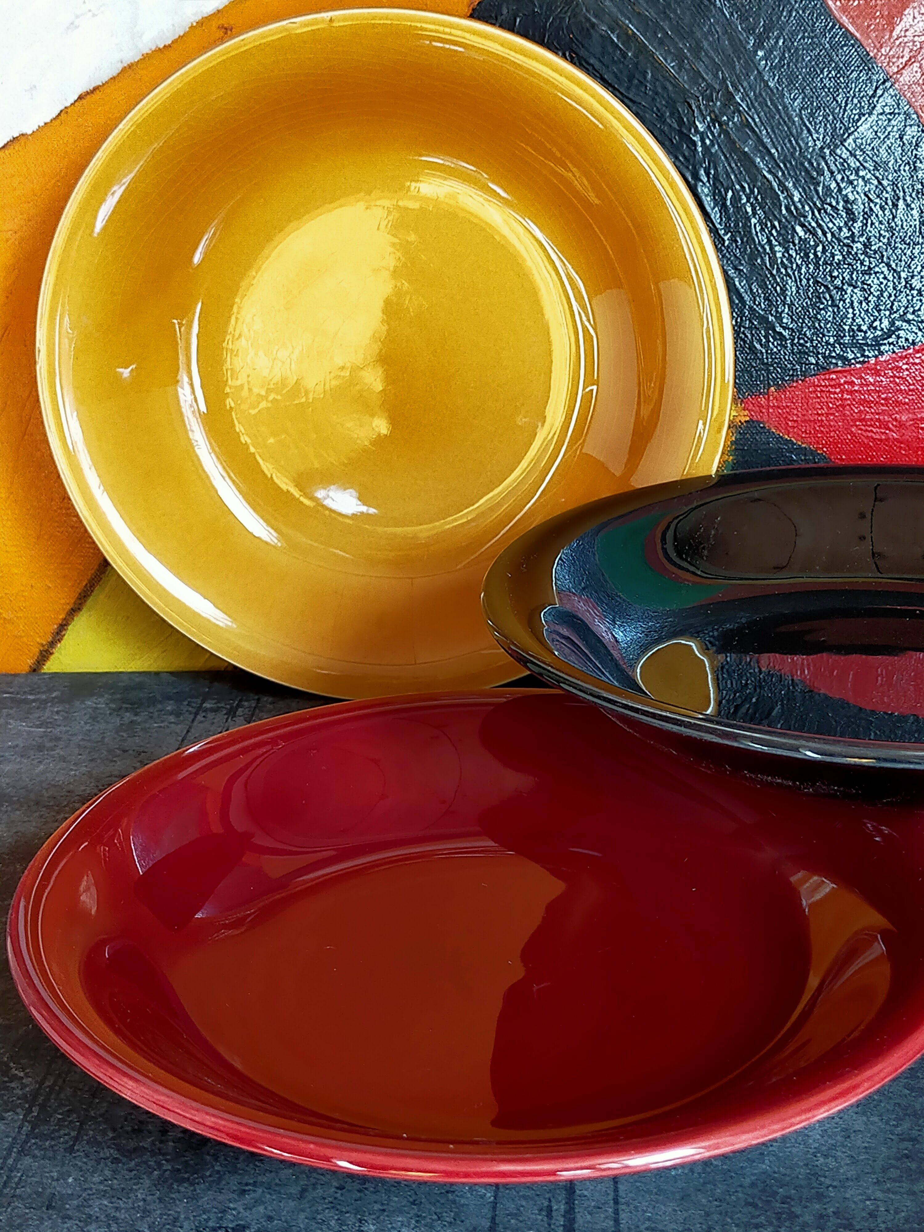 Four multicolored soup plates from the 1950s