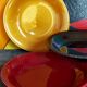 Four multicolored soup plates from the 1950s