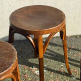 Set of four curved wooden stools stamped Baumann model 92.