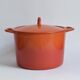 Large vintage saucepan or casserole dish in orange enameled cast iron