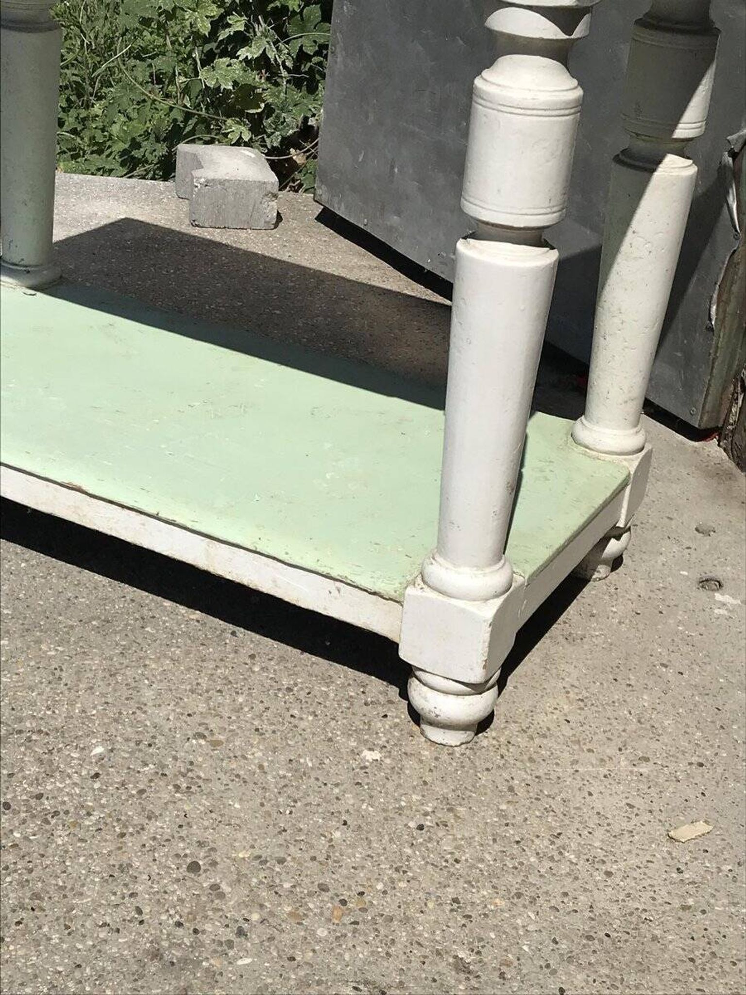 Rustic wooden dining table painted white and pale green, with a central drawer, 1950s.