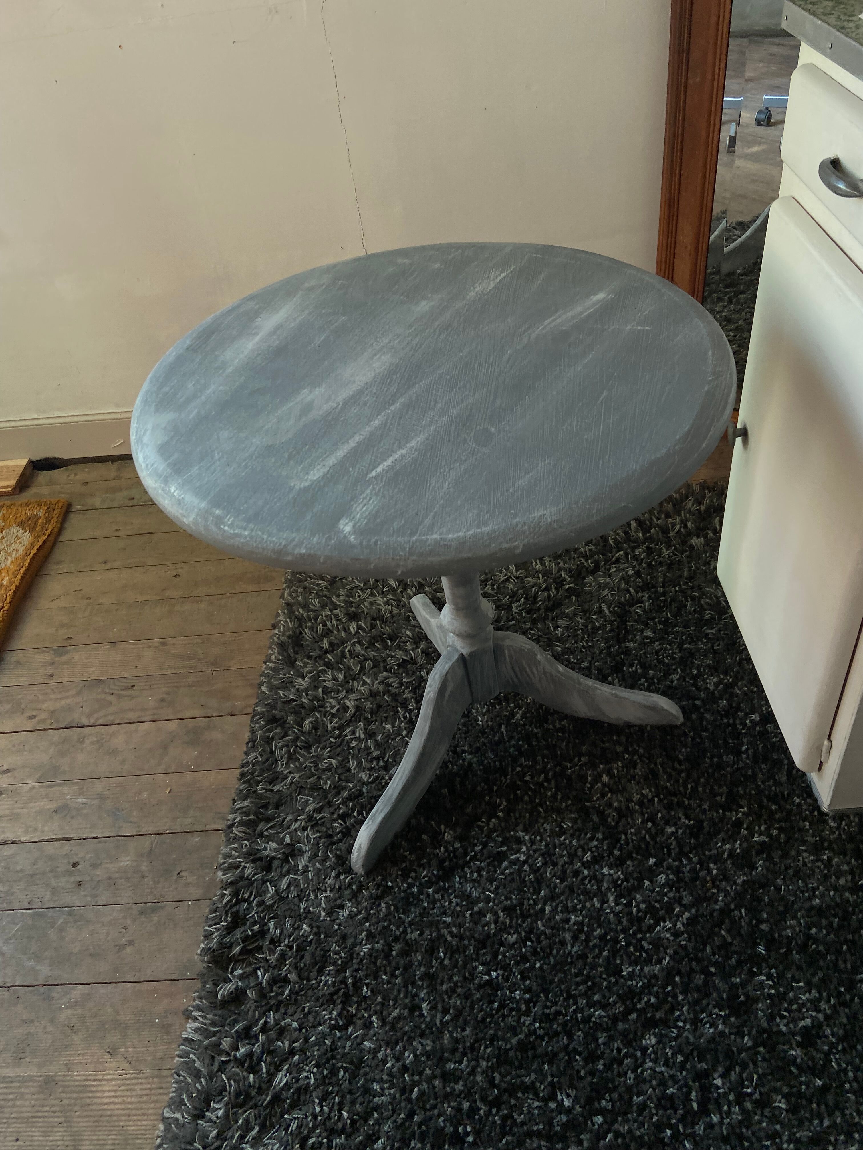 Patinated wooden pedestal table