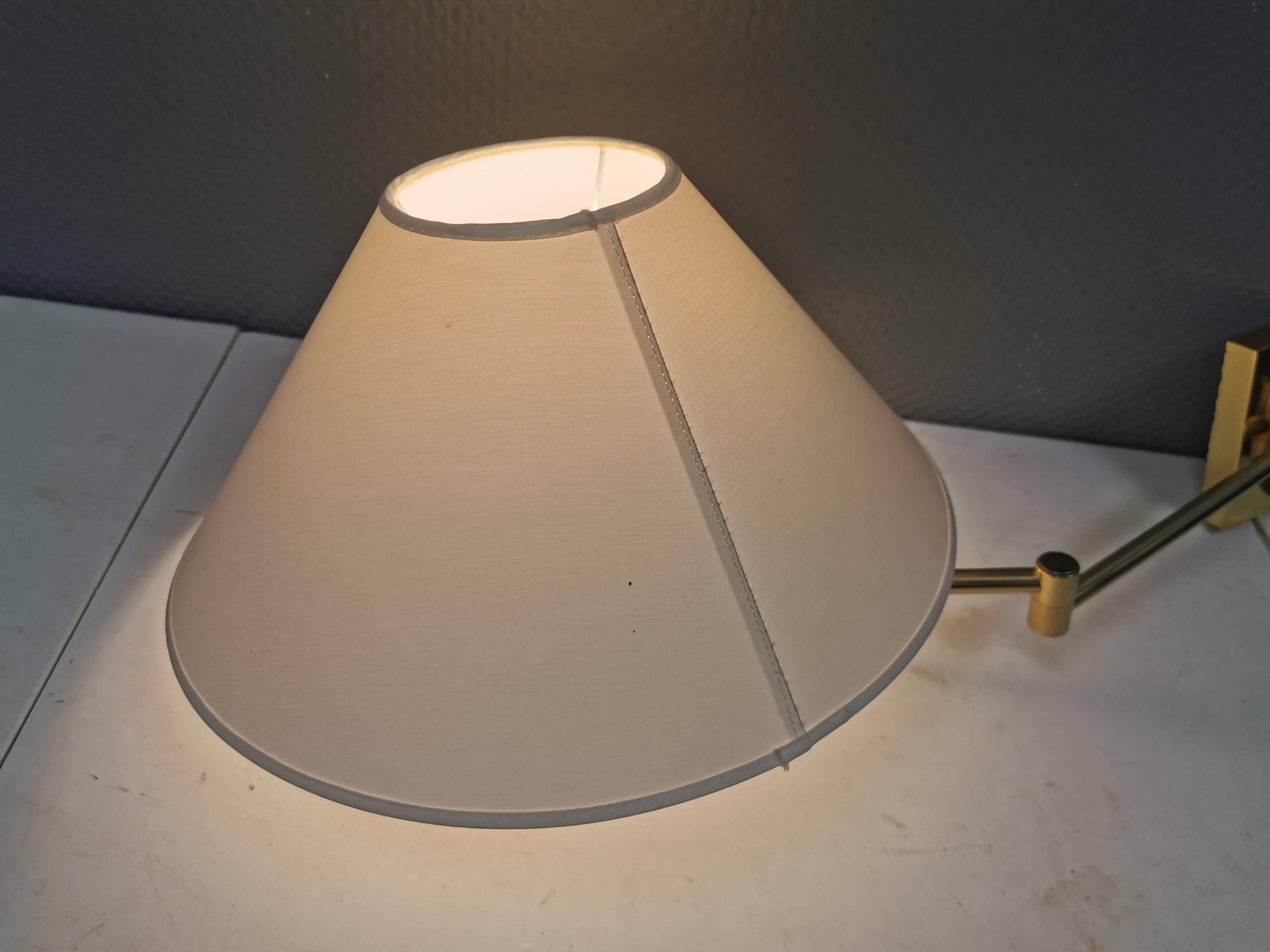 Danish Brass wall lamp with a ‘swivel’ effect.