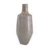 Bottle in speckled light brown sandstone