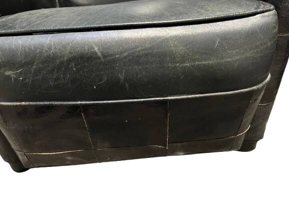 Pair of leather armchairs with marquetry armrests