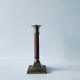 Old candle holder in brass and wood