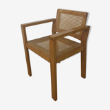Chaise cannée à accoudoirs 1960