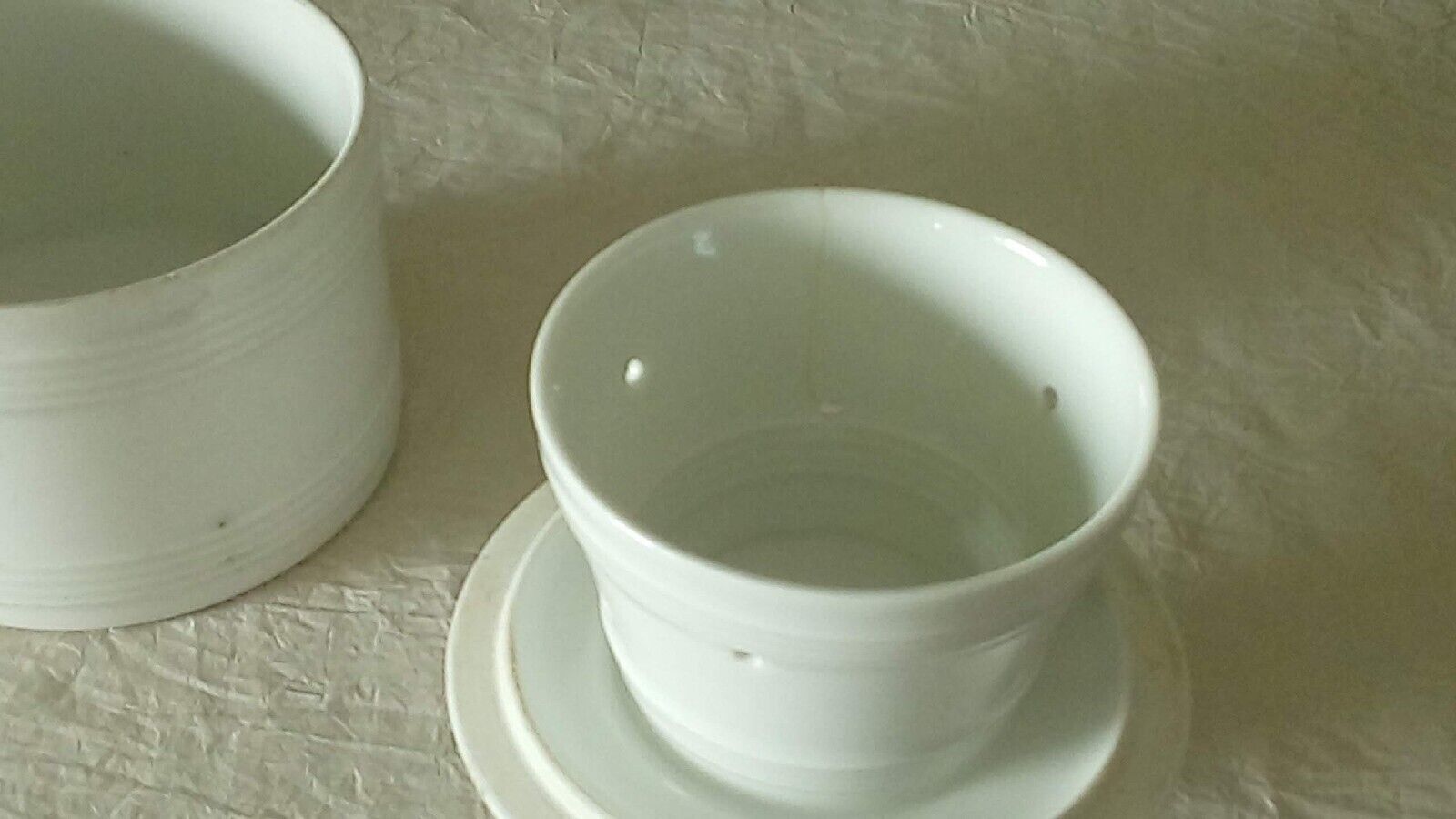 Old white porcelain water dish