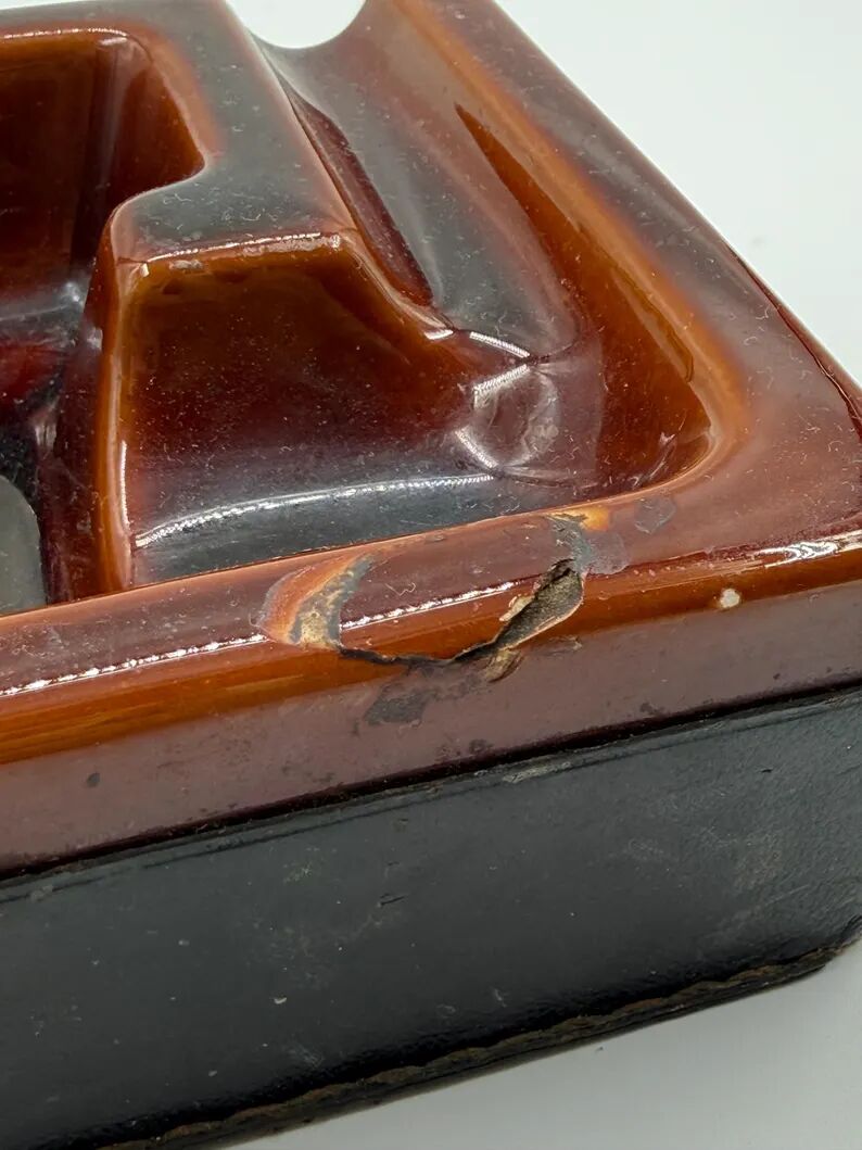 Geometric brown enamelled ashtray with a leather base (1960s-70s)