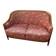 Art Deco style sofa, covered in Indian fabric with a pink background