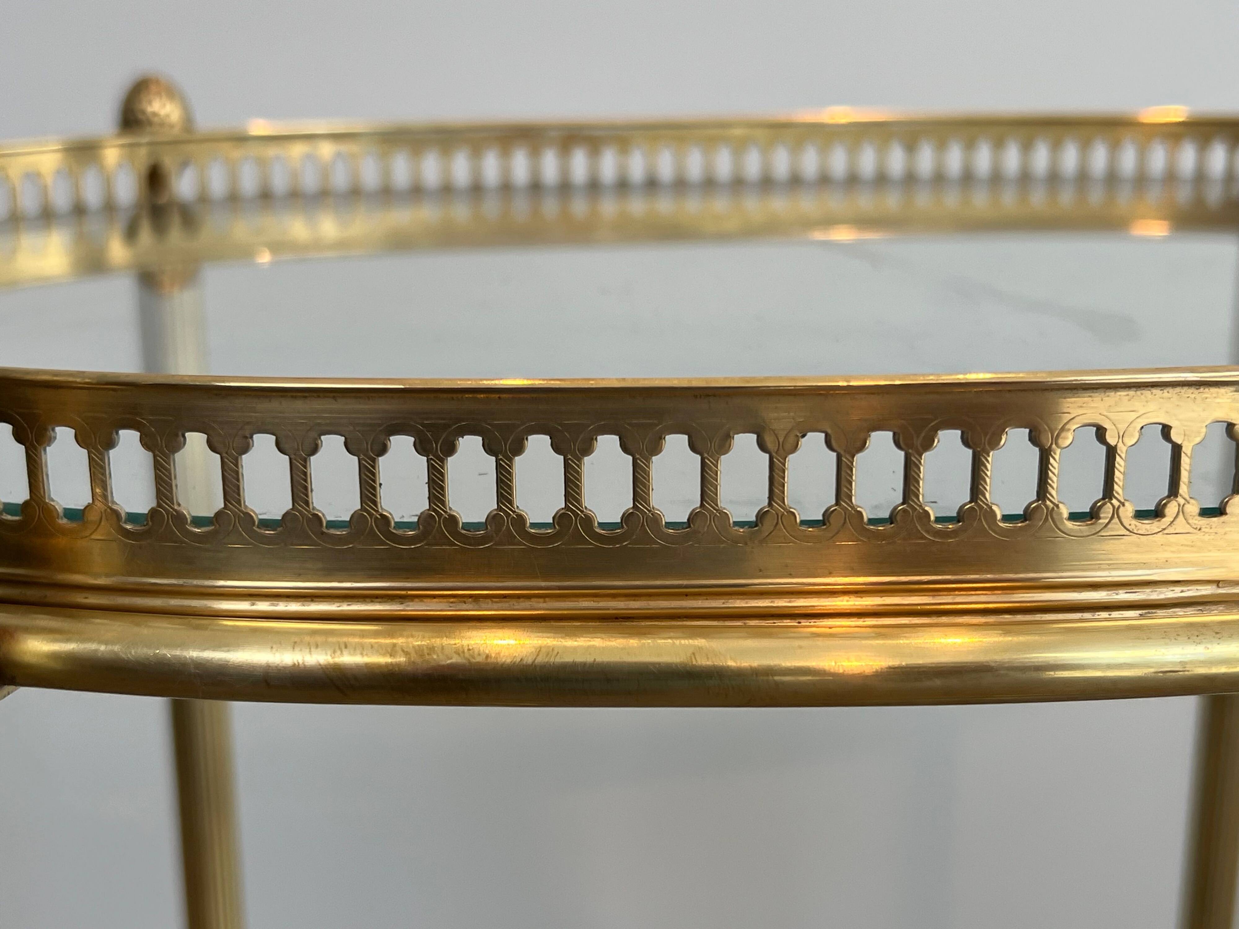 Small oval rolling table in brass with double removable trays from Maison Bagués.