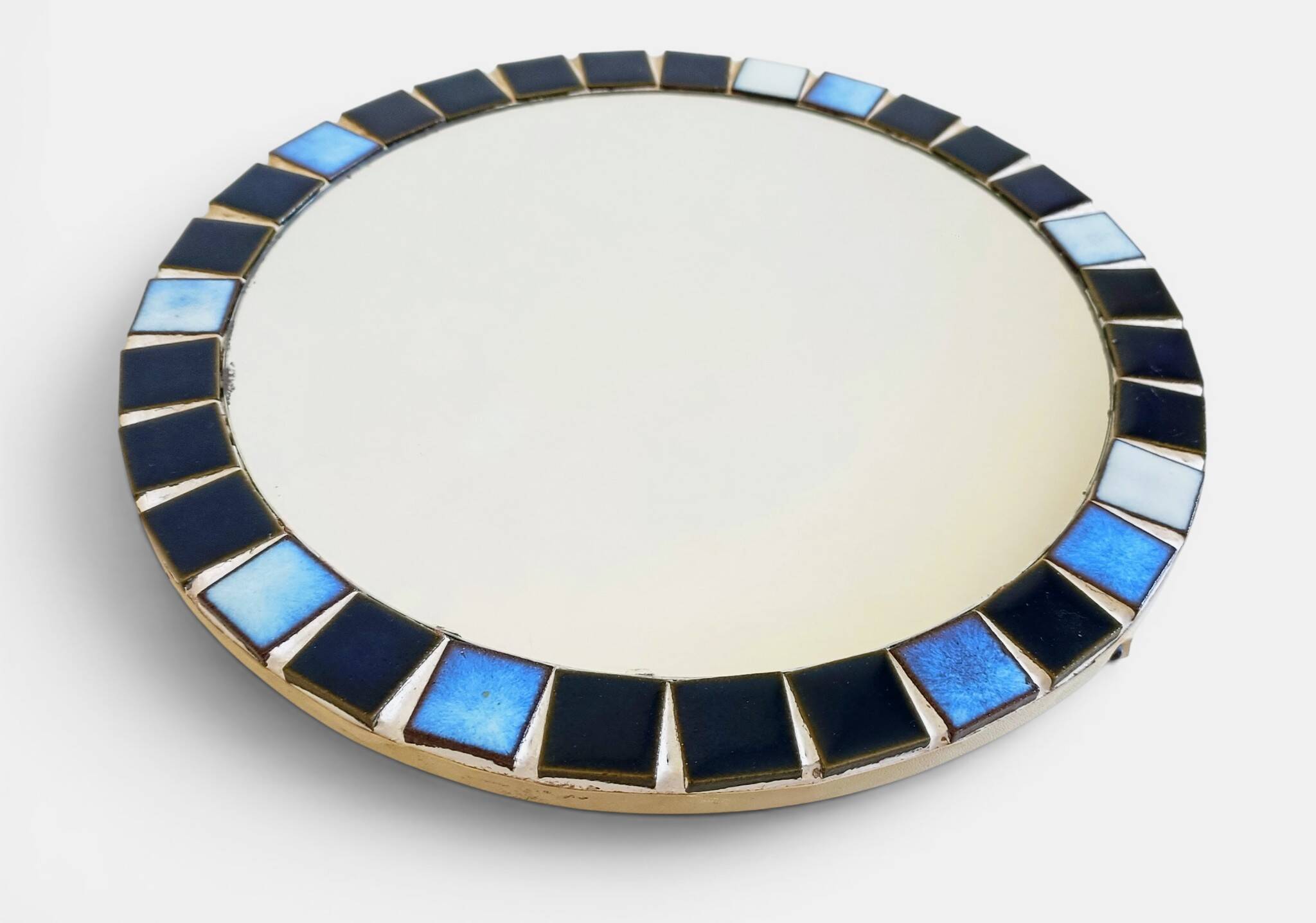 Round mosaic mirror in the style of Vallauris, France circa 1970.