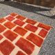 Large Moroccan Berber rug in orange and ecru wool, 400 x 300 cm.
