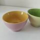Set of three pastel two-tone mini bowls in glazed ceramic.