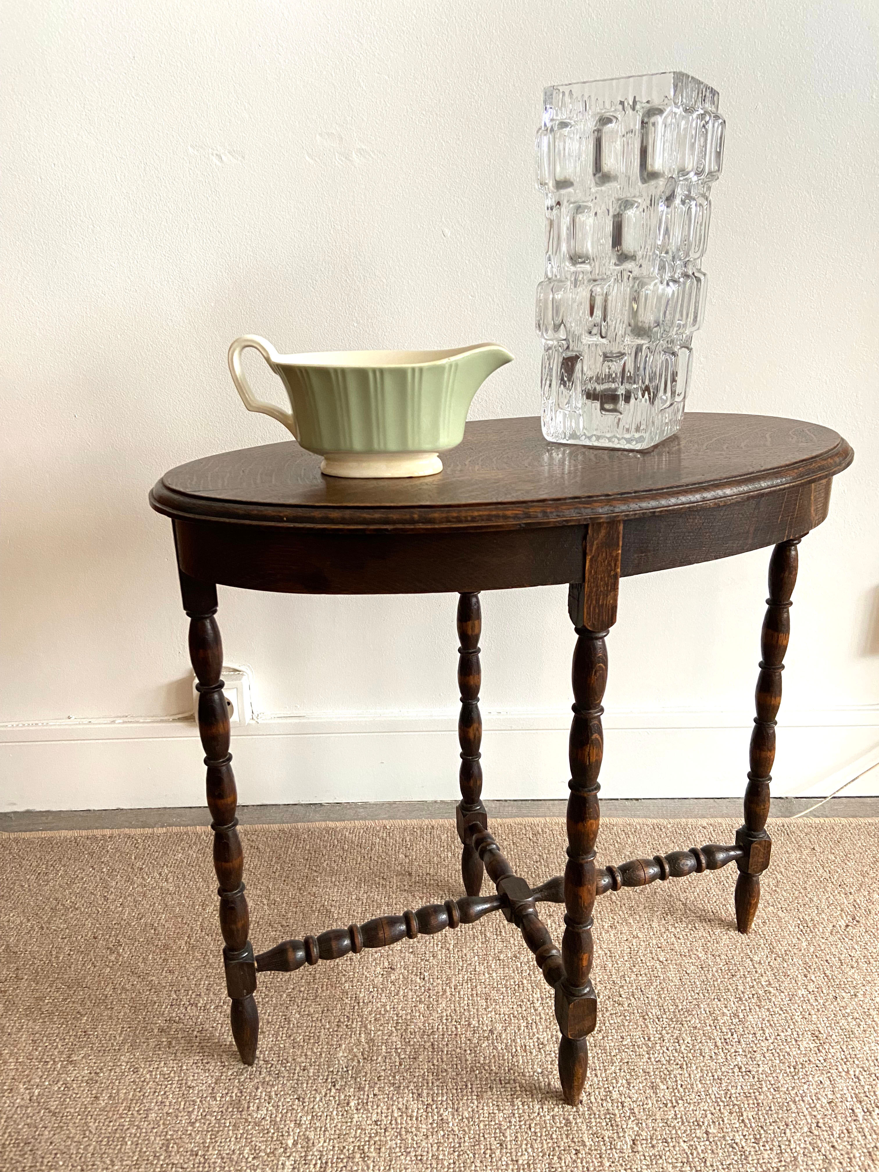 Oval wooden side table turned with spacer
